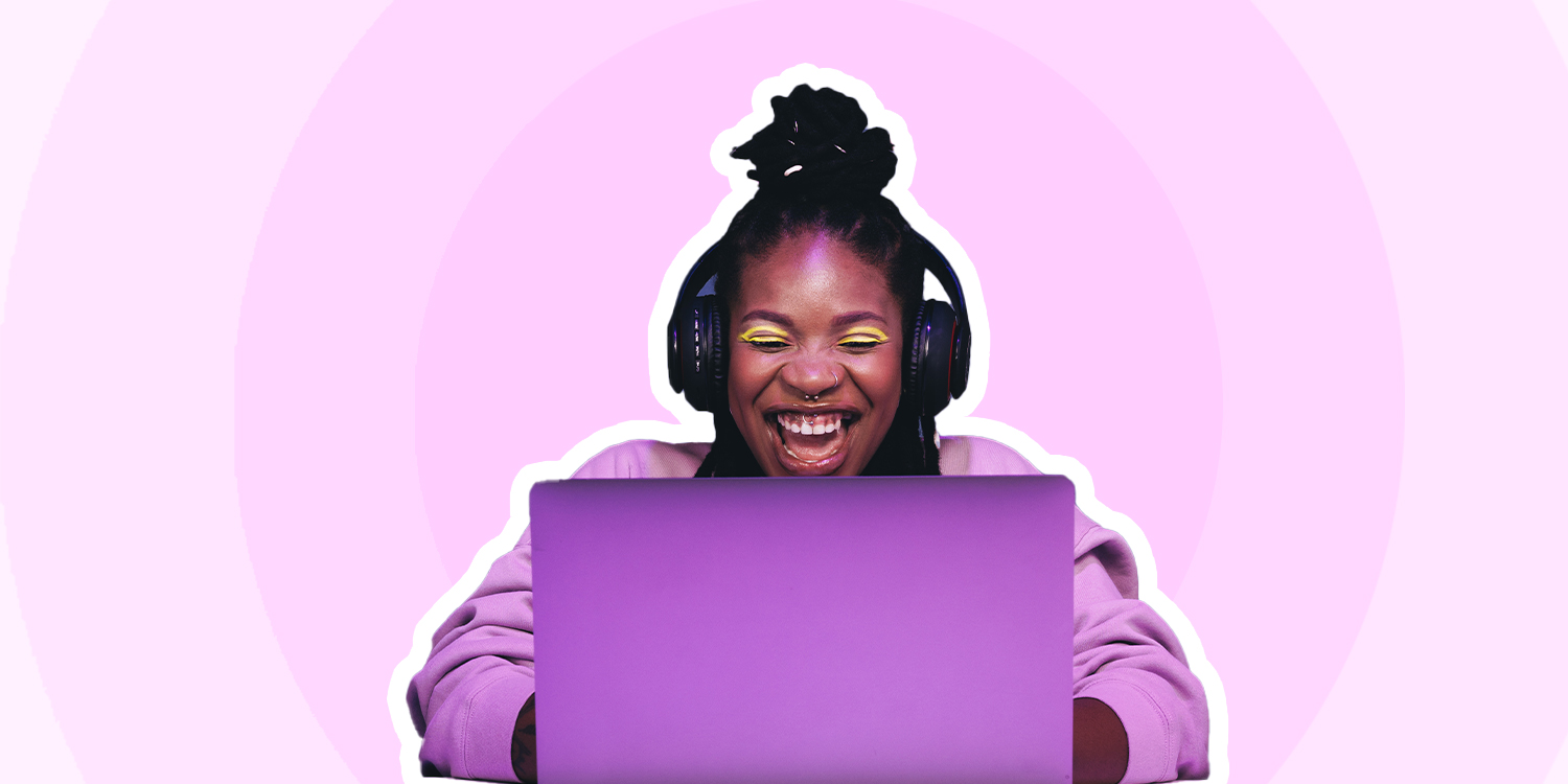 woman on computer with headphones