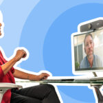 Woman in red shirt sitting in chair on zoom meeting