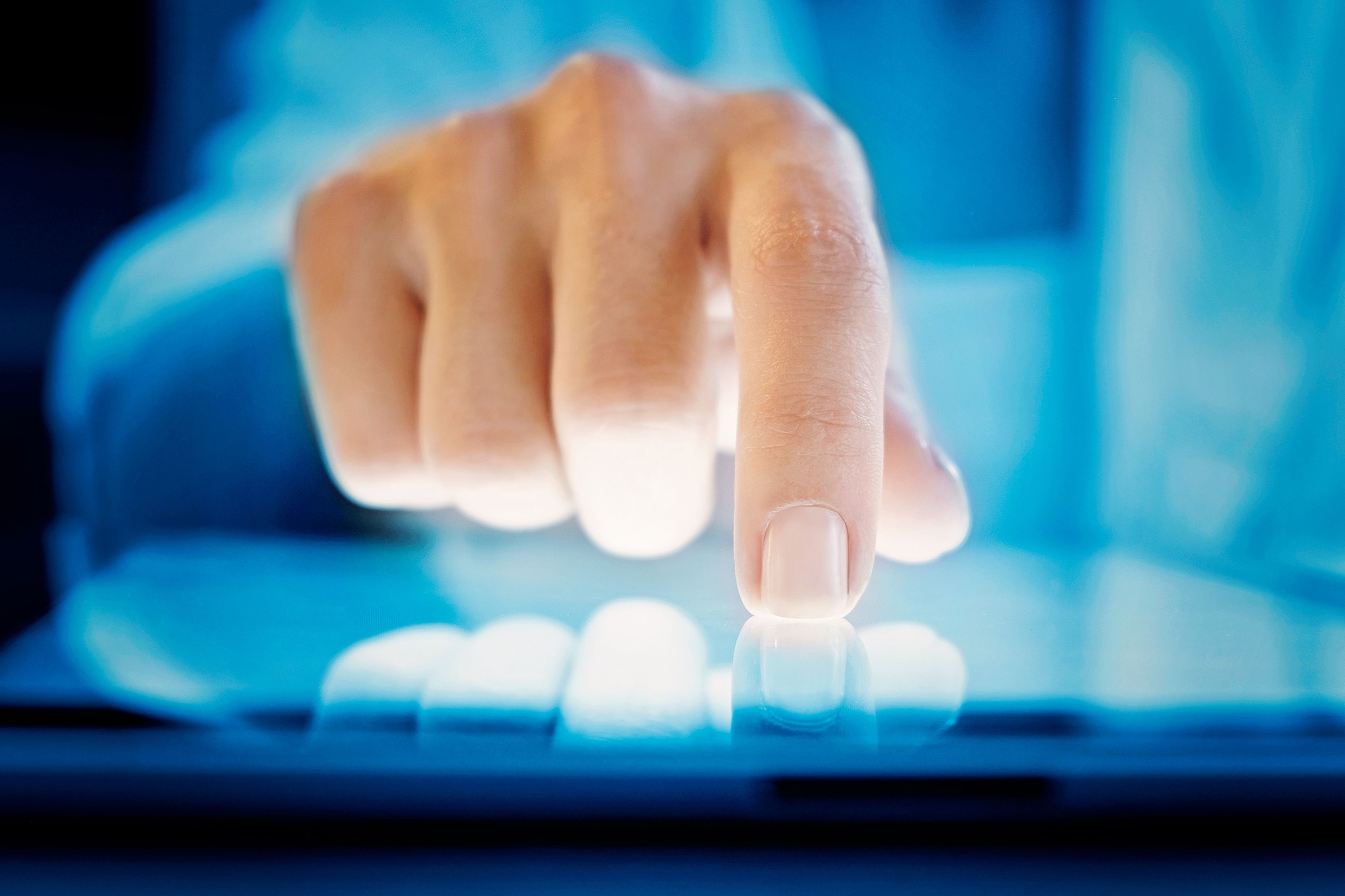 Person touching a tablet device